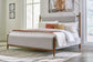 Lyncott Queen Upholstered Bed with Mirrored Dresser